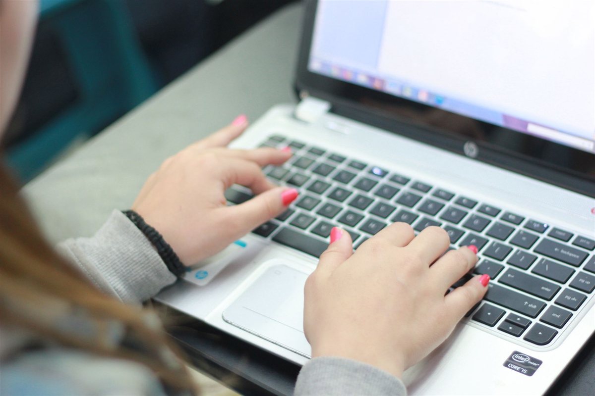 Typing on a personal laptop used for work