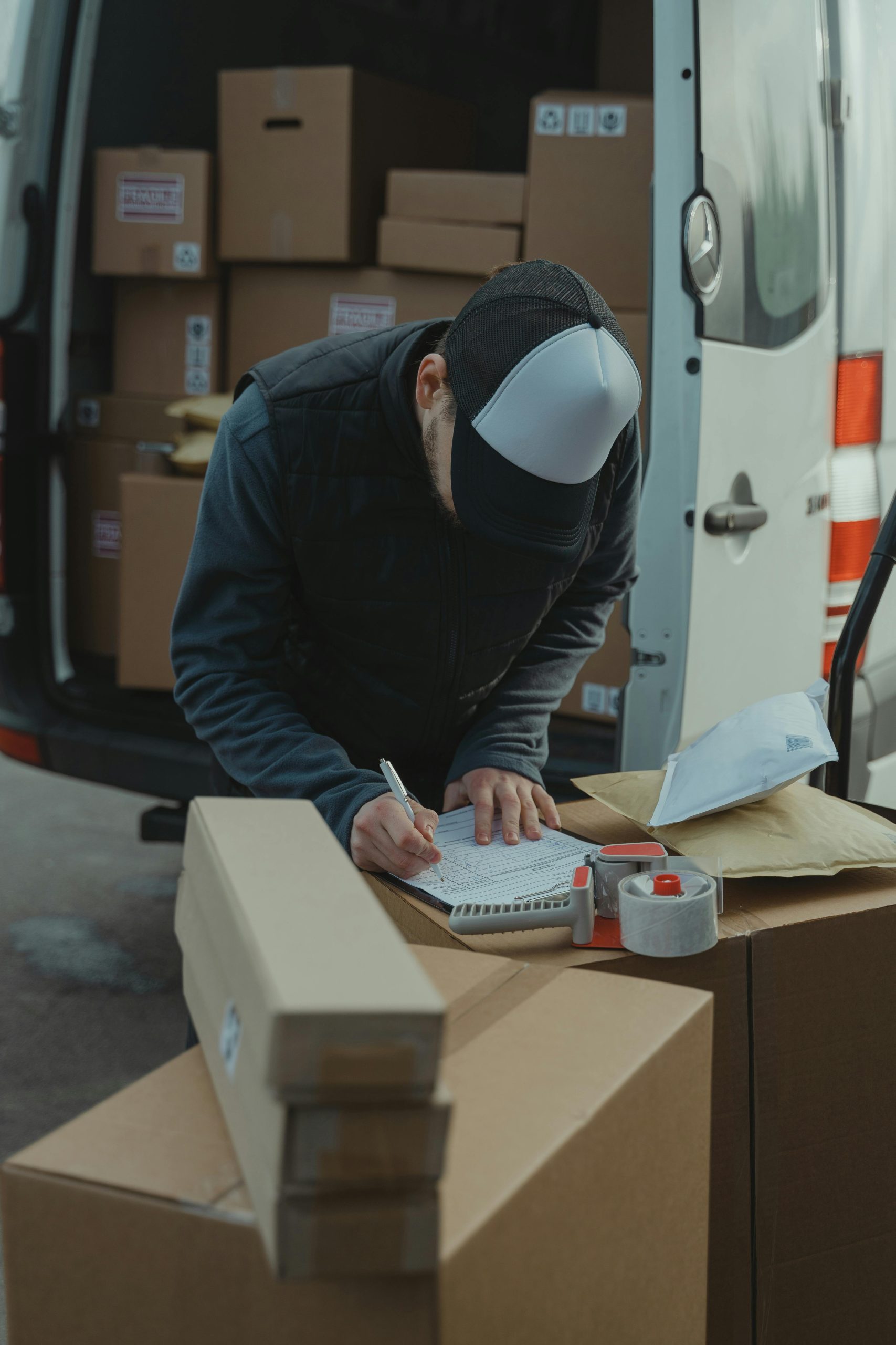 Courier preparing hardware packages for delivery